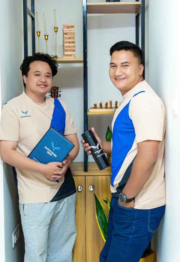 Technology Spot marketing strategists holding a company notebook